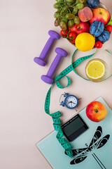 concept of losing weight and physical activity. Scales, dumbbells, tape measure, healthy food,...