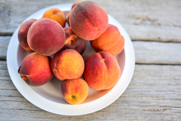 Fresh organic bio peaches on wooden background