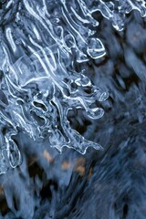 Vertical shot of vibrant ice under the natural light with a blurry background
