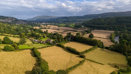 Naklejka premium Aerial view of the Welsh countryside with mountains in the distance