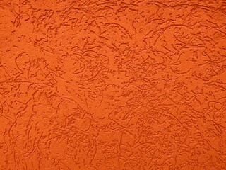 background of a decorative orange wall with embossing