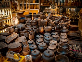 many small objects are on a table in a market room