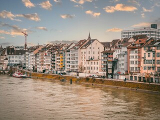 Scenic view of switzerland, featuring a tranquil river running through the city