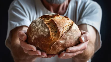 Zelfklevend Fotobehang man hold fresh baked bread in his hands © bmf-foto.de