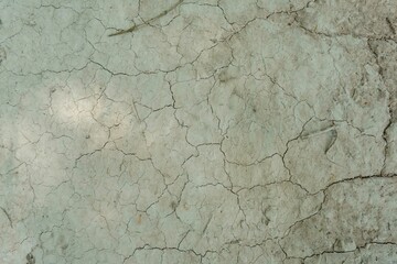 Closeup of a cracked stone surface under the bright light