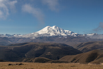 Snow-capped mountains above the mountain forests