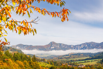 A landscape with mountain surrounded by fog in the autumn season. The Sulov Rocks, national nature reserve in northwest of Slovakia, Europe. - obrazy, fototapety, plakaty