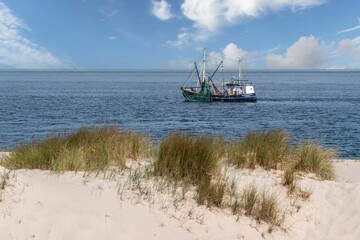 Fishing boat close to the beach of Sylt island