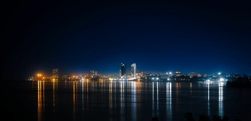a large body of water that is lit up at night