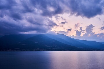 Beautiful shot of a sunset sky over Lake Como and nearby mountains