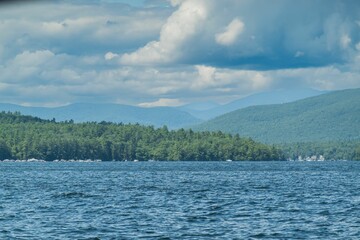 Picturesque view of New Hampshire's Lake Winnipesaukee with the Mountains in the backdrop