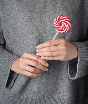 person holding a lollipop