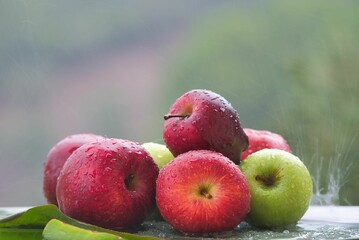 An arrangement of beautiful red and green fresh juicy apples