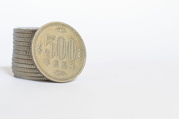 Closeup of a 500 yen japanese coin on a white background