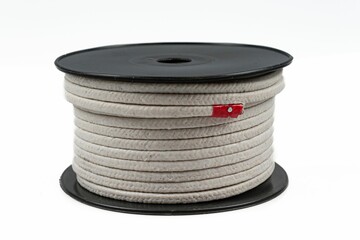 Closeup of a sealing braid on a spool isolated on a white background