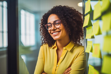 Business woman brainstorming ideas with colorful sticky notes, schedule planning