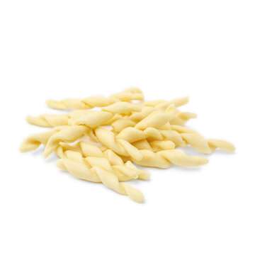 Pile of uncooked trofie pasta isolated on white
