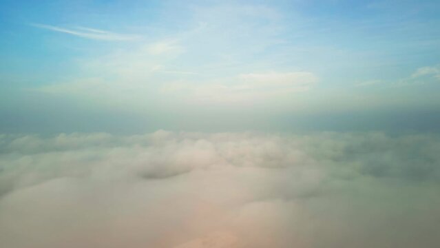 Drone Flying through the cloud and blue sky. Wide shot