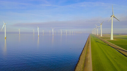 offshore windmill park with clouds and a blue sky, wind mill turbines in the Netherlands