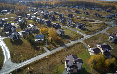 Aerial photo of scientific cottage village Sigma. Beautiful autumn country landscape from above....