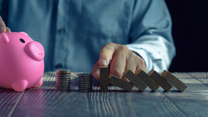 Economic collapse concept, hands stop domino crisis effect, financial and banking problems,...