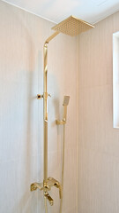 Shower room decorated with light gold frame