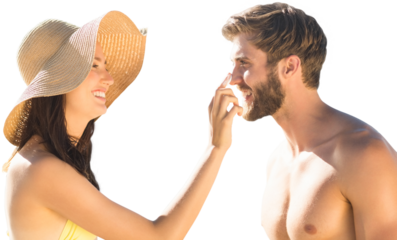 Digital png photo of happy caucasian couple using sunblock on vacation on transparent background