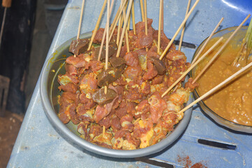 Close up shot of roasted goat satay, a popular dish in Indonesia.