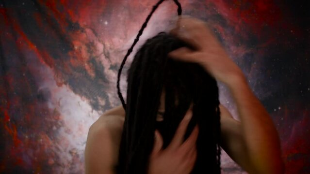 Nervous man gathering his thoughts, pulling dreadlocks