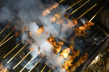 Close up shot of roasted goat satay, a popular dish in Indonesia.
