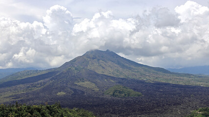Fototapeta premium Panoramic view of Mount Batur mountain in Bali. It is an active volcano situated at the center of two concentric calderas.