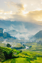 Mu Can Chai, harvesting rice terrace fields landscape with fire smoke on horizon near Sapa, Northern Vietnam - obrazy, fototapety, plakaty