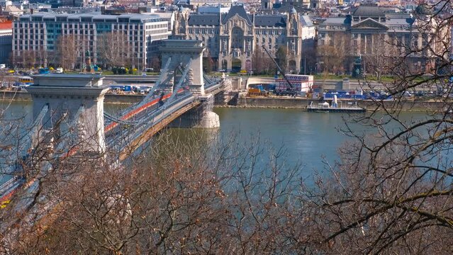 Relaxing place on danube bank. A cute traveling relaxing places of Secheni bridge over Danube river under sun rays.