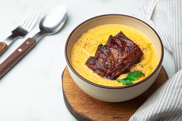 Corn cream soup with glazed pork ribs bbq