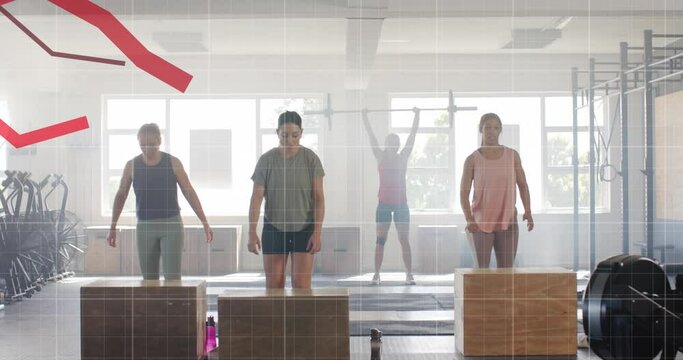 Animation of graph processing data over diverse women jumping on boxes cross training at gym