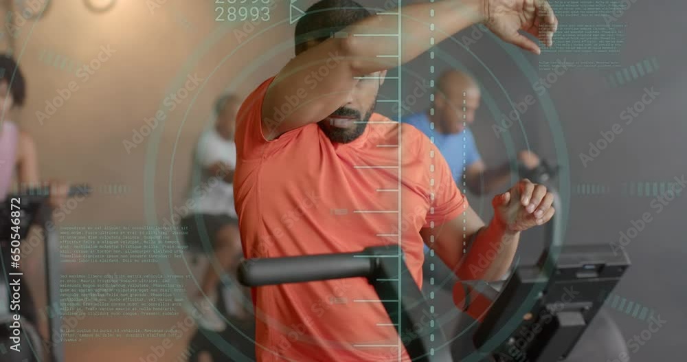 Aufkleber animation of scanner processing data over biracial man cross training on elliptical at gym