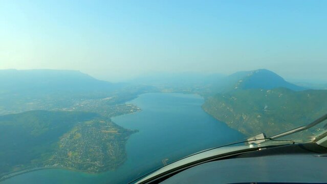 POV From Airplane Cockpit Flying Over The Lake Bourget Towards The Chambery Savoie Mont Blanc Airport In France. - aerial