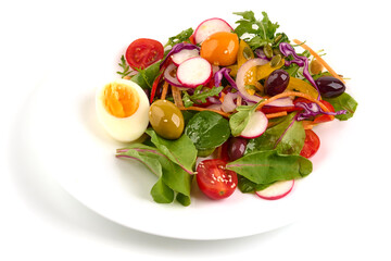 Vegetarian salad with eggs, arugula salad, olives and fresh vegetables isolated on white background.