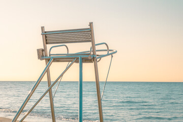 sunrise on beach with lifeguard chair room for text - Beach Lifeguard Security Coastline Safety...
