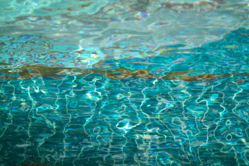 Light reflects in the swimming pool