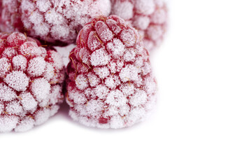 Frozen raspberries isolated on white background.