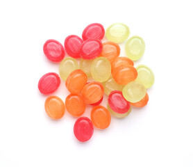 Heap of colorful candies on a white background