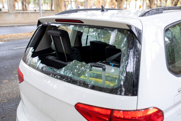 Broken rear window after theft  a stolen car's unfortunate aftermath.