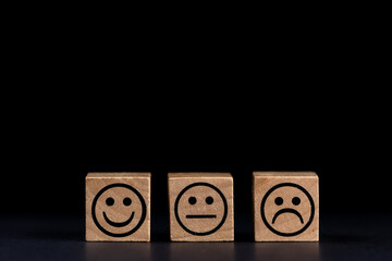 smiling, sad and normal face icons on black background