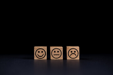 smiling, sad and normal face icons on black background