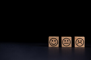 smiling, sad and normal face icons on black background