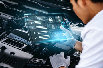 Mechanic using tablet checking up on car engines parts for fixing and repair, Smart service diagnostics software concept. - obrazy, fototapety, plakaty