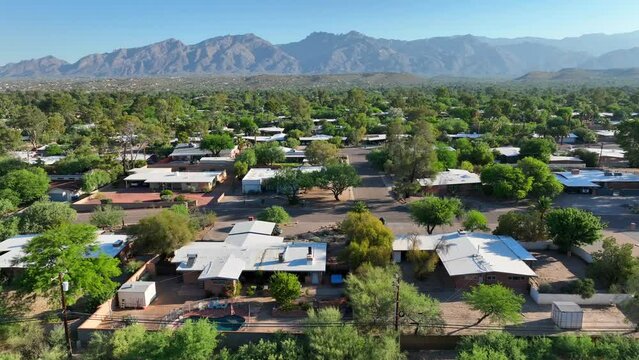 Neighborhood in Arizona. Aerial truck shot above houses and homes with desert landscape.
