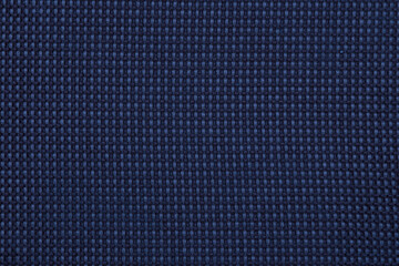 Textile deep blue fabric upholstery of an office chair as a texture, pattern, background