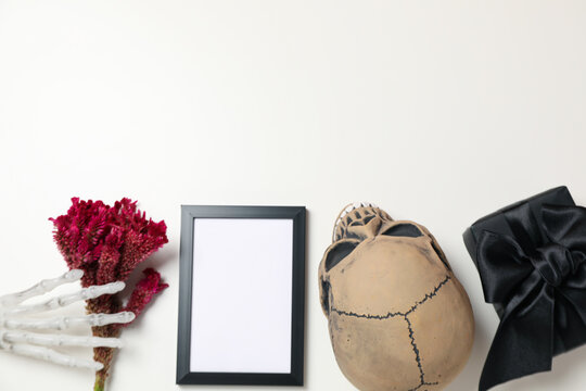 Bones, gift box and photo frame on white background, space for text